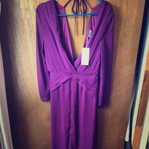 Low cut long sleeved flowy and sheer dress